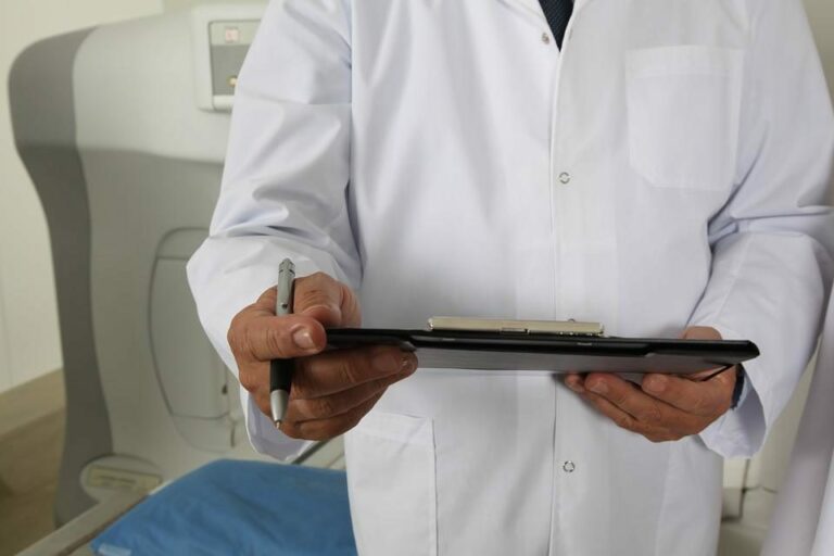 A doctor holding a clipboard