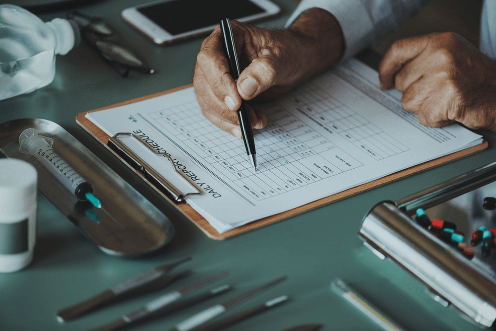 A doctor completing a form