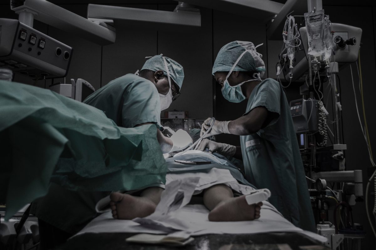 Surgeons operating on someone