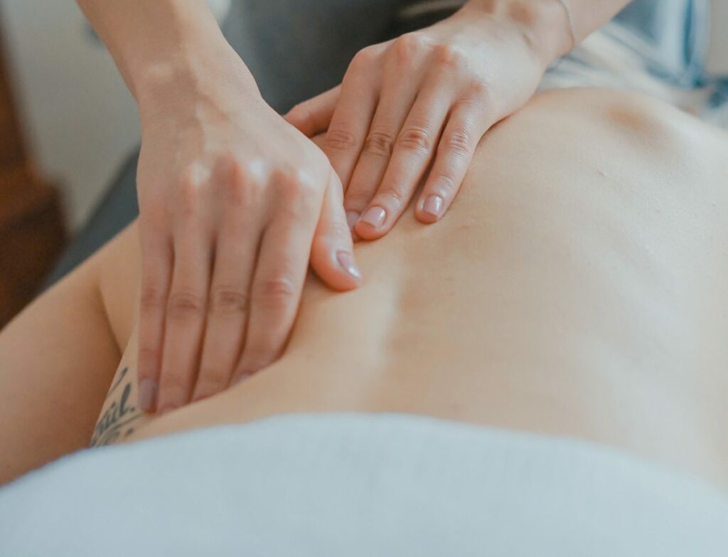 Close up of a back being massaged