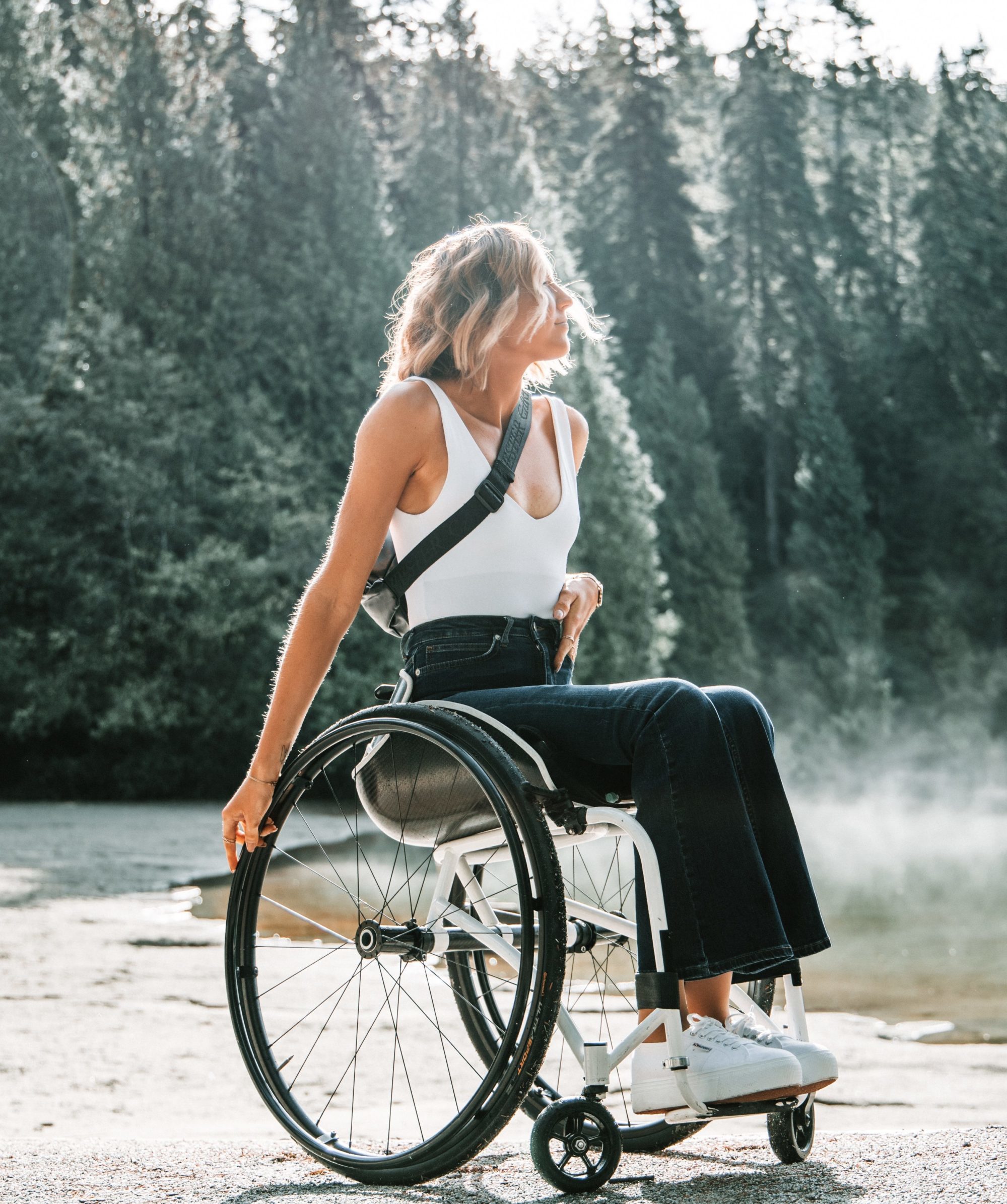 Inspirational woman in a wheelchair in the woods