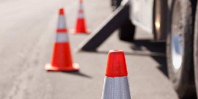 Road cones next to a vehicle