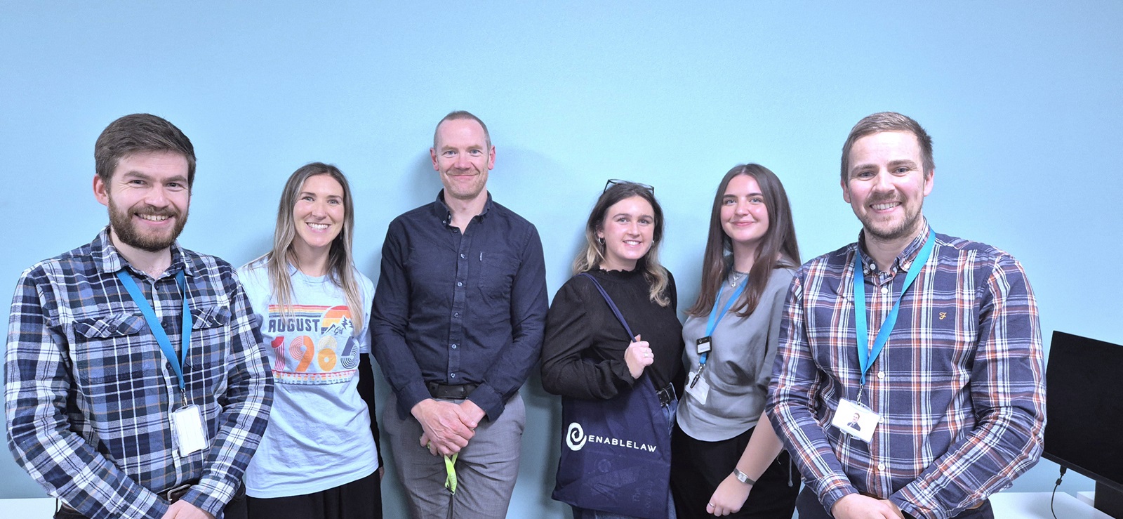 The Enable Law Abuse Team wearing blue