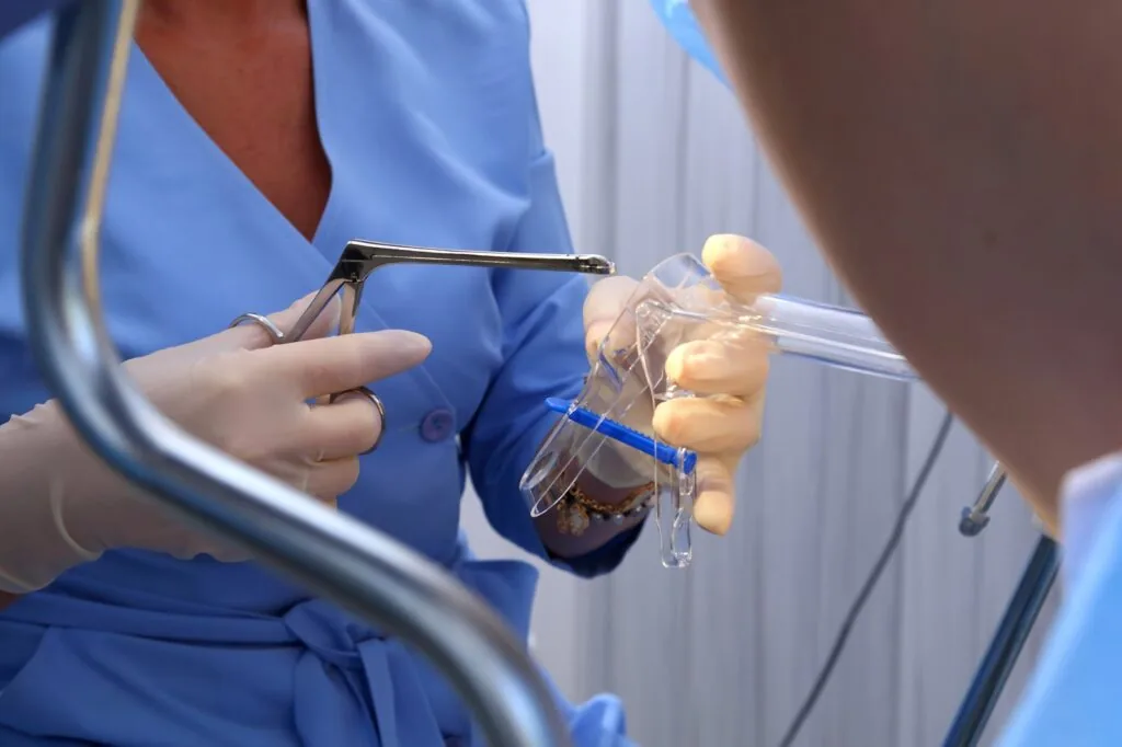 A,Gynecologist,Performs,A,Cervical,Biopsy.,Gynecological,Chair.,A,Woman