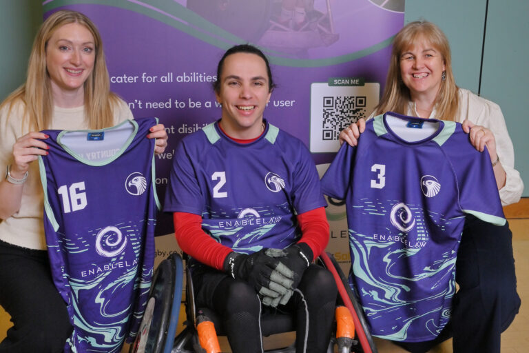 WHEEL OF FORTUNE - Hawks chairperson Jesse Hayes with Enable Law solictiors Charlotte Morgan and Michelle Biddulph