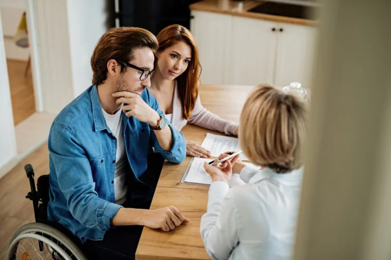 High,Angle,View,Of,A,Couple,And,Real,Estate,Agent