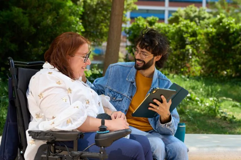 Happy,Friends,Sharing,A,Moment,Of,Studying,Outdoors,-,Wheelchair