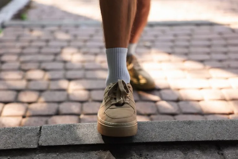 Young,Man,With,Stylish,Shoes,Before,Running,Outdoors,,Closeup