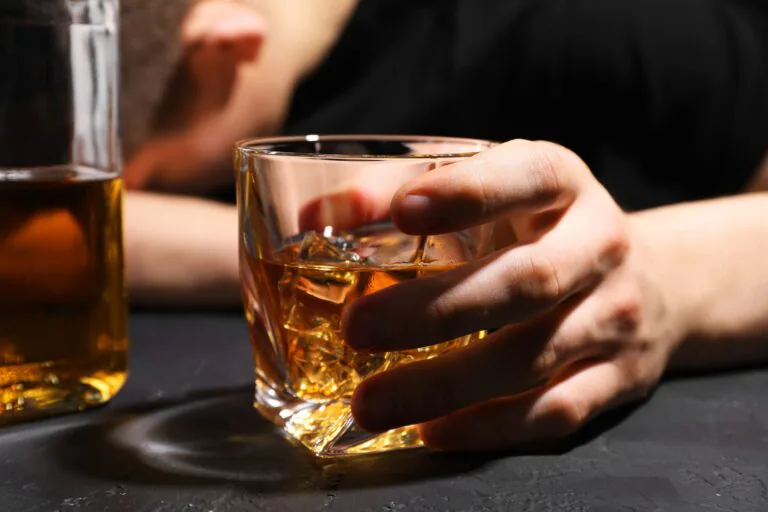 Alcohol,Addiction.,Man,With,Glass,Of,Whiskey,At,Dark,Textured
