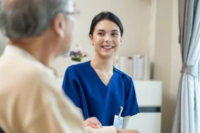 Asian,Nurse,Take,Care,Of,Senior,Man,On,Wheelchair,At